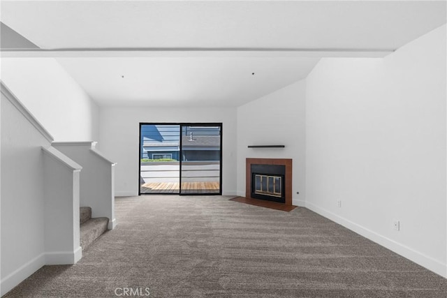 2220 Exposition Dr Unit 64, San Luis Obispo, CA 93401 - unfurnished living room with carpet floors, stairs, baseboards, and a fireplace with flush hearth