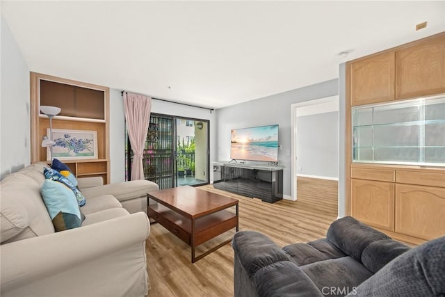 321 N Orange Unit 104, Monterey Park, CA 91755 - living room with light wood-style flooring and baseboards