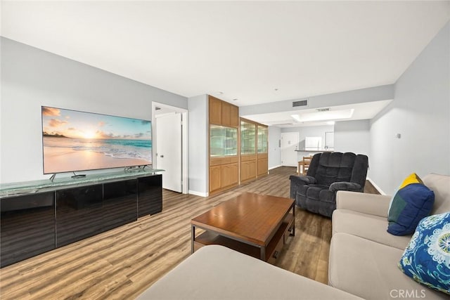 321 N Orange Unit 104, Monterey Park, CA 91755 - living area featuring baseboards, visible vents, and wood finished floors