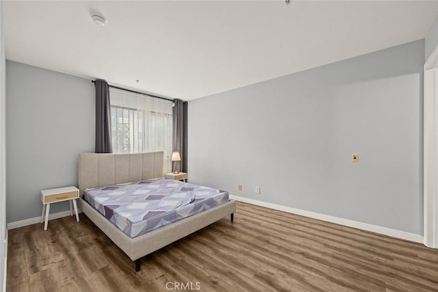 321 N Orange Unit 104, Monterey Park, CA 91755 - bedroom with baseboards and wood finished floors
