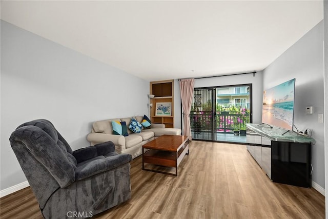 321 N Orange Unit 104, Monterey Park, CA 91755 - living room featuring baseboards and wood finished floors
