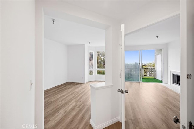 interior space featuring wood finished floors and baseboards