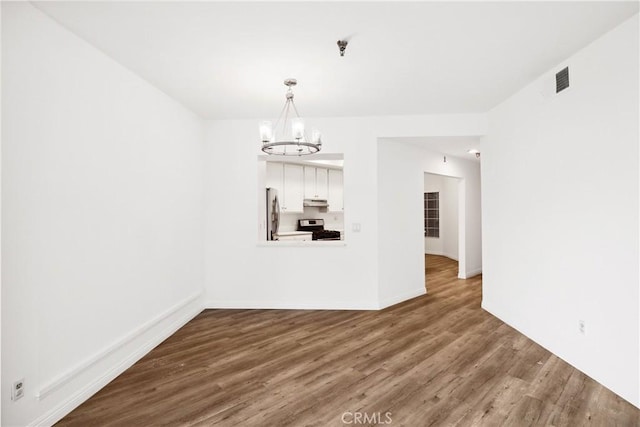 1450 Brett Pl Unit 205, San Pedro, CA 90732 - unfurnished dining area with a chandelier and wood finished floors