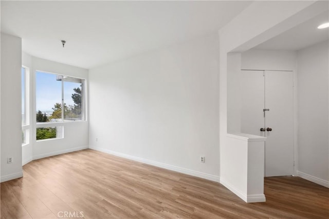 1450 Brett Pl Unit 205, San Pedro, CA 90732 - spare room featuring light wood finished floors, a pendent fire sprinkler, and baseboards