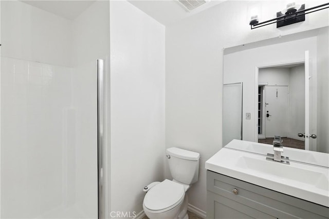 1450 Brett Pl Unit 205, San Pedro, CA 90732 - bathroom featuring toilet, a walk in shower, vanity, and baseboards