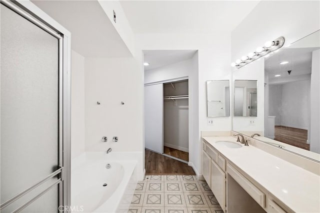 1450 Brett Pl Unit 205, San Pedro, CA 90732 - full bath featuring a garden tub, vanity, a walk in closet, recessed lighting, and a shower
