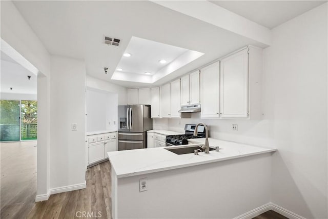 1450 Brett Pl Unit 205, San Pedro, CA 90732 - kitchen featuring appliances with stainless steel finishes, light wood-style flooring, baseboards, light stone counters, and recessed lighting