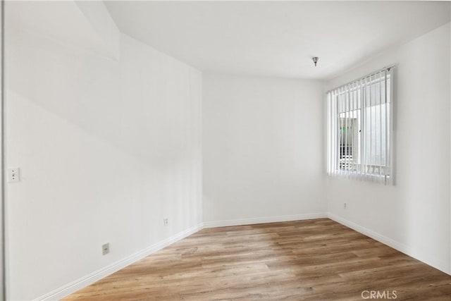 1450 Brett Pl Unit 205, San Pedro, CA 90732 - unfurnished room featuring light wood-type flooring, baseboards, and fire sprinkler in ceiling