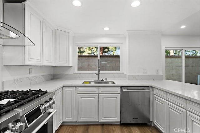 16 Encina, Irvine, CA 92620 - kitchen with recessed lighting, a sink, ventilation hood, stainless steel appliances, and white cabinets