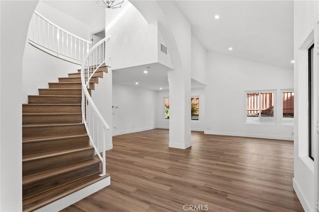 16 Encina, Irvine, CA 92620 - interior space featuring high vaulted ceiling, visible vents, recessed lighting, stairway, and baseboards