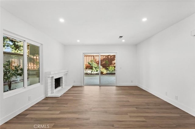 16 Encina, Irvine, CA 92620 - unfurnished living room with a brick fireplace, plenty of natural light, and recessed lighting