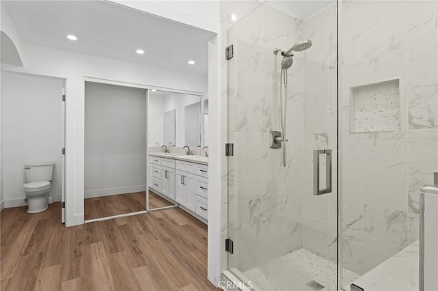 16 Encina, Irvine, CA 92620 - full bath featuring toilet, a marble finish shower, wood finished floors, and recessed lighting