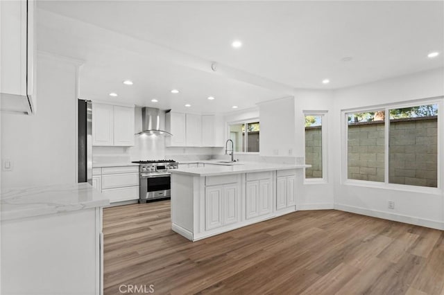 16 Encina, Irvine, CA 92620 - kitchen with a sink, wall chimney range hood, light wood-style floors, and appliances with stainless steel finishes