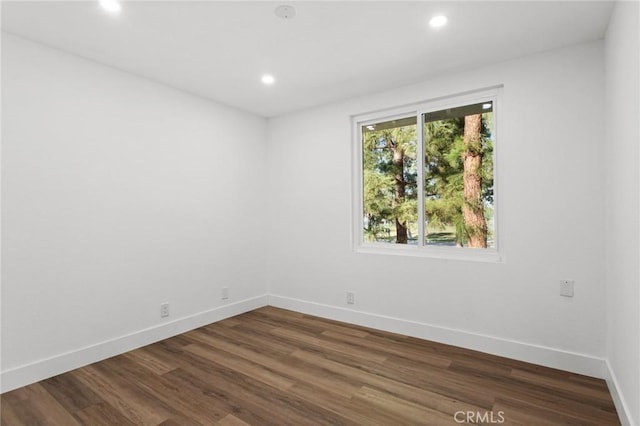 16 Encina, Irvine, CA 92620 - spare room with baseboards, dark wood-style flooring, and recessed lighting