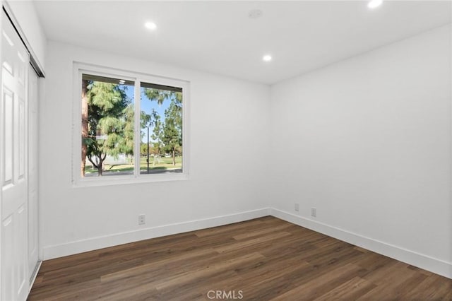 16 Encina, Irvine, CA 92620 - unfurnished bedroom with baseboards, dark wood-style floors, and recessed lighting