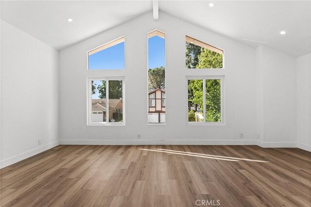16 Encina, Irvine, CA 92620 - interior space with wood finished floors, baseboards, a healthy amount of sunlight, and vaulted ceiling with beams