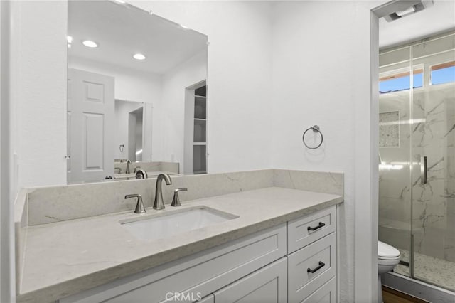 16 Encina, Irvine, CA 92620 - full bath with a marble finish shower, recessed lighting, vanity, and toilet