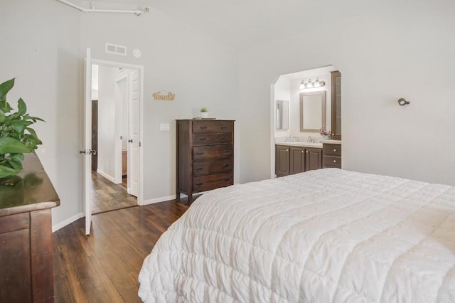 3465 Barrett Vw, Alpine, CA 91901 - bedroom featuring dark wood finished floors, baseboards, a sink, lofted ceiling, and arched walkways