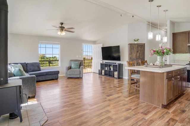 3465 Barrett Vw, Alpine, CA 91901 - kitchen with open floor plan, a breakfast bar, a ceiling fan, light countertops, and lofted ceiling