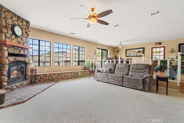 770 Roads End, Lebec, CA 93243 - carpeted living room featuring a stone fireplace, visible vents, and ceiling fan