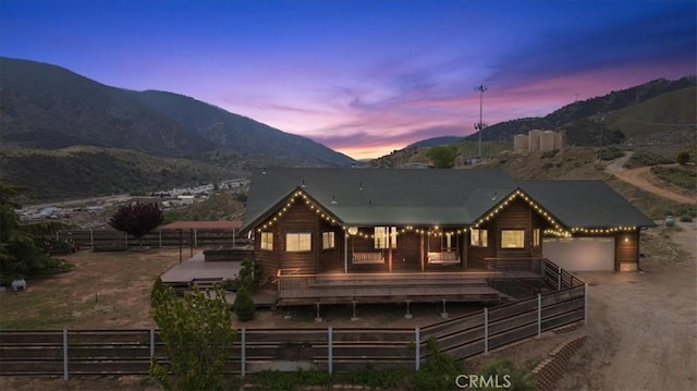 770 Roads End, Lebec, CA 93243 - view of front of property featuring a garage, driveway, a mountain view, and fence