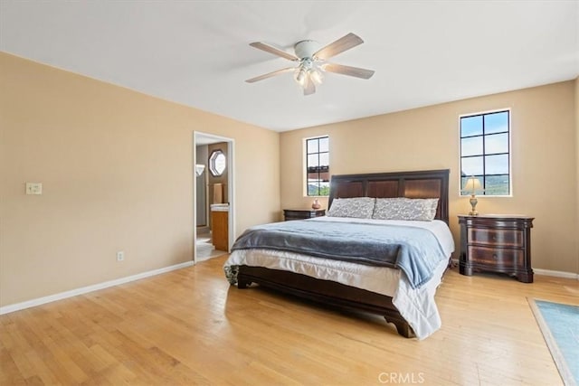 770 Roads End, Lebec, CA 93243 - bedroom with ensuite bathroom, baseboards, light wood-type flooring, and multiple windows