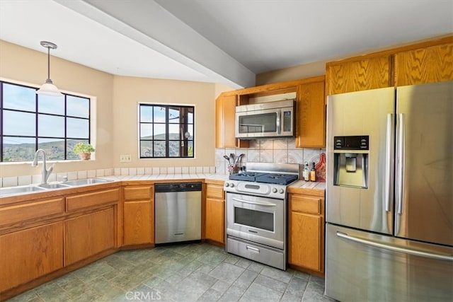 770 Roads End, Lebec, CA 93243 - kitchen with a sink, backsplash, tile countertops, decorative light fixtures, and appliances with stainless steel finishes