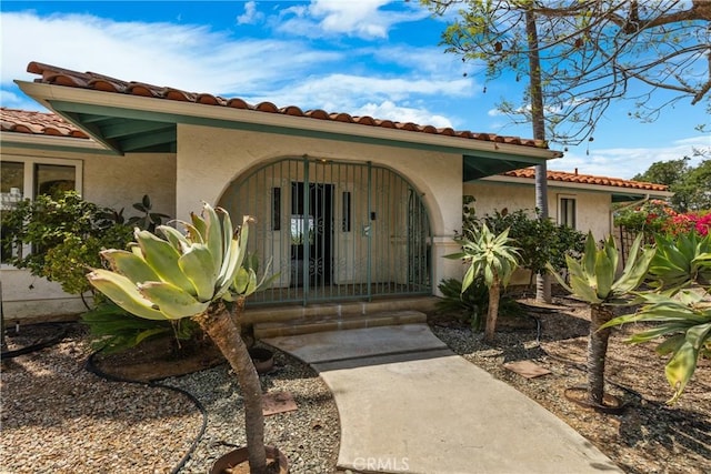 2918 Los Campos Dr, Fallbrook, CA 92028 - property entrance with a tile roof and stucco siding