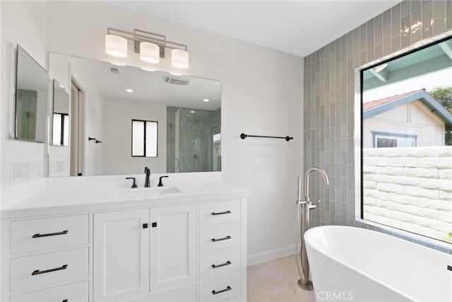 2918 Los Campos Dr, Fallbrook, CA 92028 - full bathroom featuring a shower stall, vanity, a freestanding tub, and baseboards