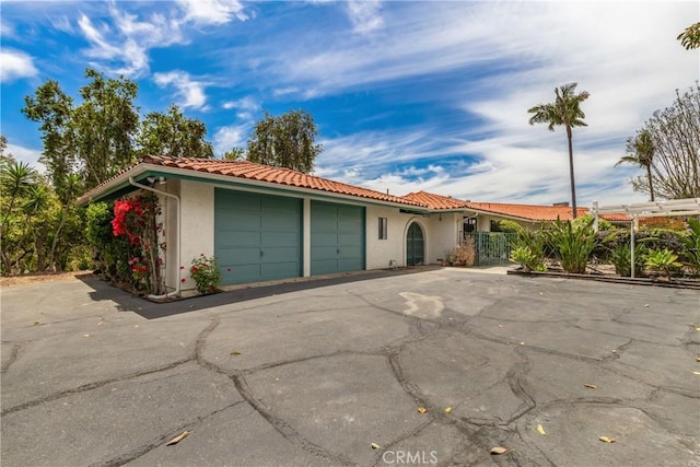 2918 Los Campos Dr, Fallbrook, CA 92028 - view of front facade with a garage, a tile roof, and stucco siding