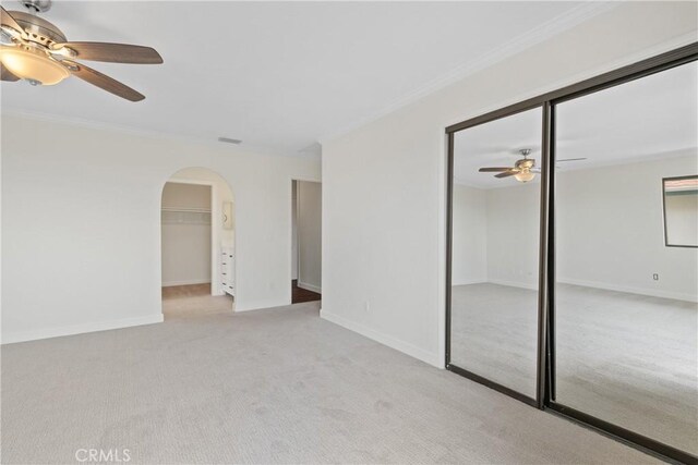 2918 Los Campos Dr, Fallbrook, CA 92028 - carpeted spare room featuring ceiling fan, ornamental molding, arched walkways, and baseboards