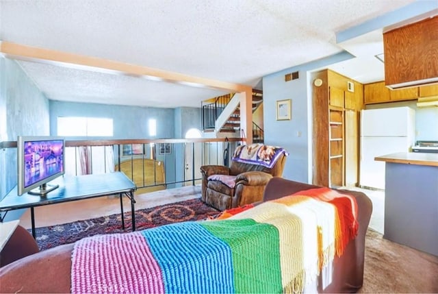 866 W Alondra Blvd, Compton, CA 90220 - carpeted living room featuring a textured ceiling and stairs
