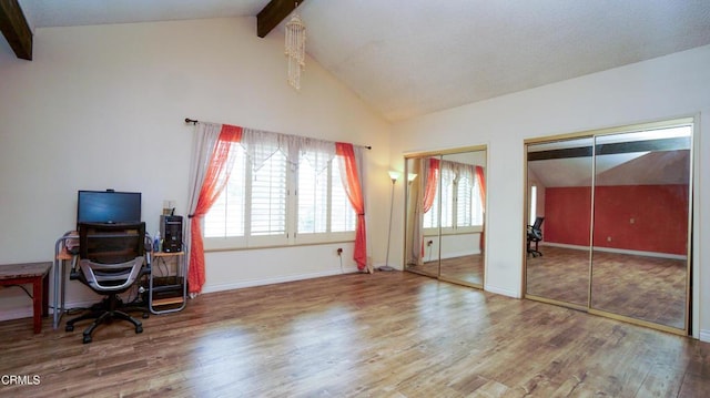7816 Quartz Ave, Los Angeles, CA 91306 - office area with beam ceiling, wood finished floors, healthy amount of natural light, baseboards, and high vaulted ceiling