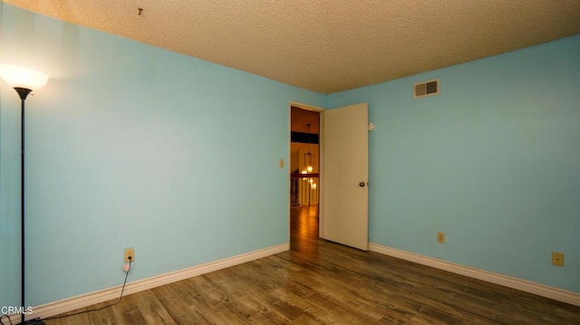 7816 Quartz Ave, Los Angeles, CA 91306 - spare room featuring wood finished floors, a textured ceiling, and baseboards