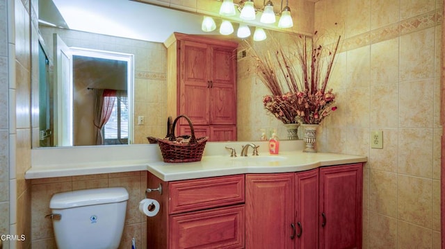 7816 Quartz Ave, Los Angeles, CA 91306 - bathroom featuring tile walls, toilet, and vanity