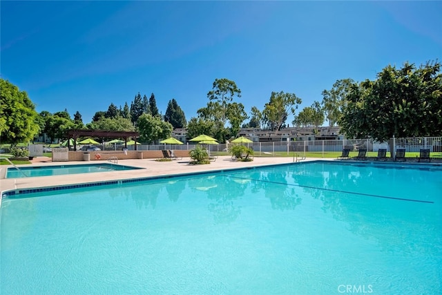 community pool featuring fence