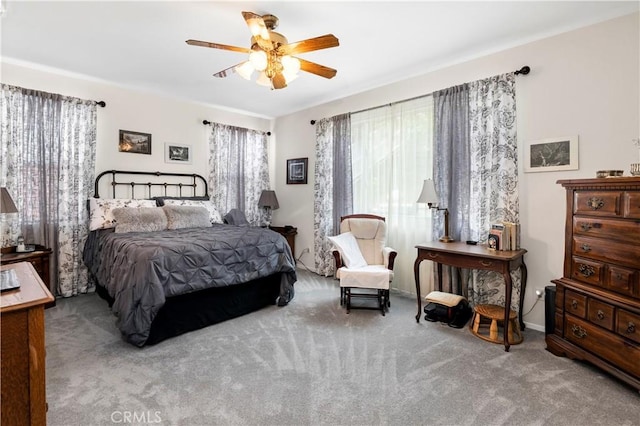 carpeted bedroom with a ceiling fan
