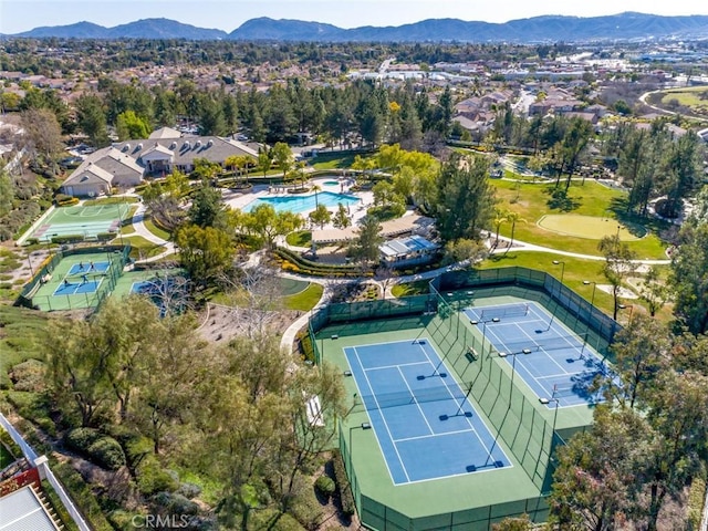 drone / aerial view featuring a residential view and a mountain view