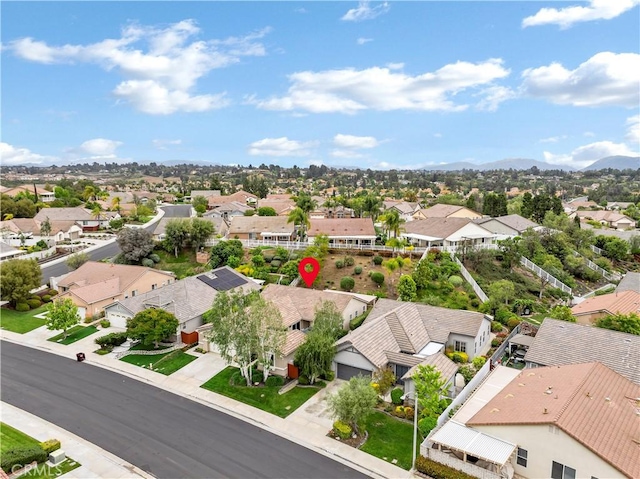 birds eye view of property with a mountain view and a residential view