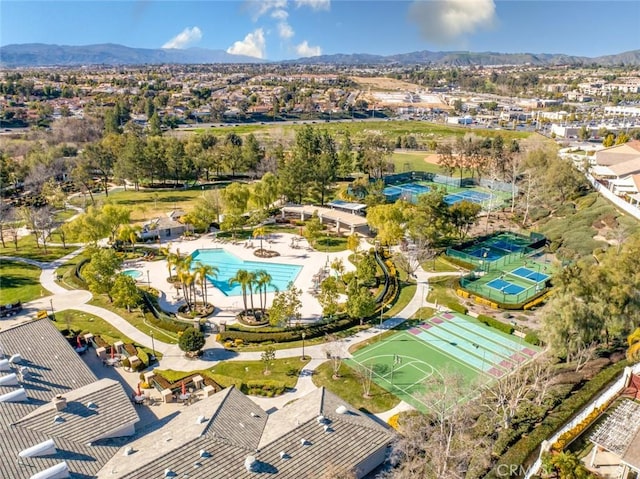 birds eye view of property with a mountain view and a residential view