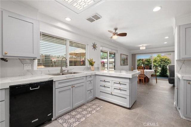 27071 Calle Caballero Unit B, San Juan Capistrano, CA 92675 - kitchen with black dishwasher, a sink, a peninsula, ceiling fan, and light stone counters