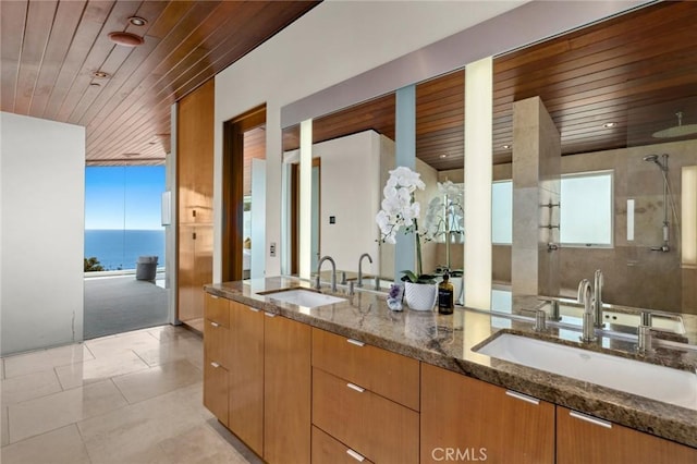 856 Diamond, Laguna Beach, CA 92651 - full bathroom featuring wood ceiling, plenty of natural light, tile patterned floors, double vanity, and a shower