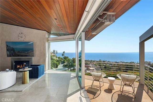 856 Diamond, Laguna Beach, CA 92651 - balcony featuring a water view and a lit fireplace