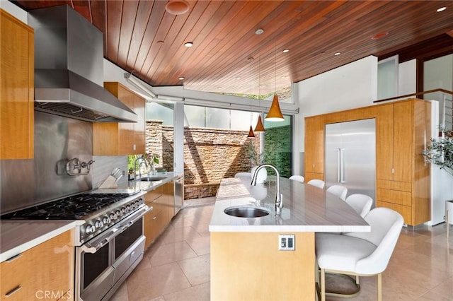856 Diamond, Laguna Beach, CA 92651 - kitchen featuring premium appliances, a sink, range hood, wooden ceiling, and a center island with sink