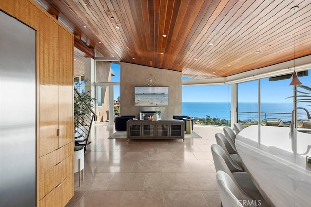 856 Diamond, Laguna Beach, CA 92651 - tiled living room featuring wooden ceiling, a water view, a glass covered fireplace, recessed lighting, and floor to ceiling windows