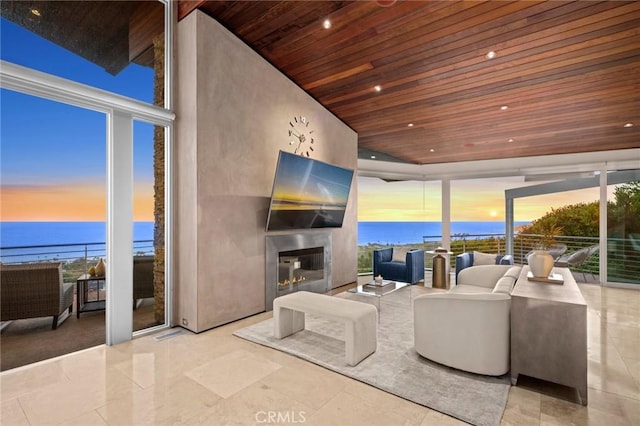 856 Diamond, Laguna Beach, CA 92651 - living area featuring wood ceiling, floor to ceiling windows, a water view, and a glass covered fireplace
