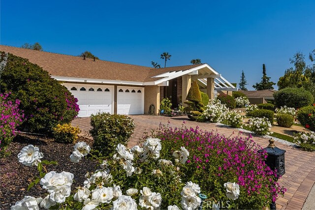 9492 Brynmar Dr, Villa Park, CA 92861 - view of front facade featuring a garage and decorative driveway