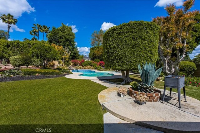 9492 Brynmar Dr, Villa Park, CA 92861 - view of property's community featuring a lawn, a patio, and a swimming pool