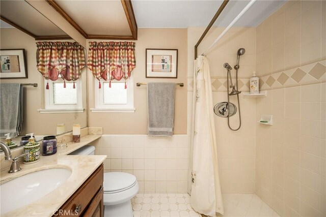 9492 Brynmar Dr, Villa Park, CA 92861 - full bath featuring tile walls, a tile shower, toilet, vanity, and wainscoting