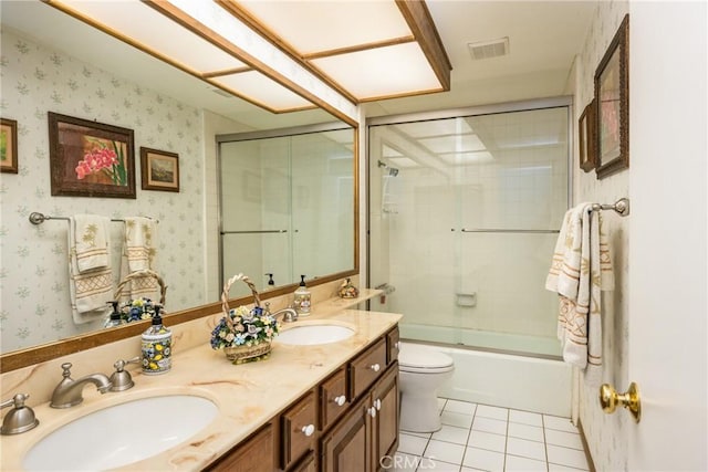 9492 Brynmar Dr, Villa Park, CA 92861 - bathroom with tile patterned floors, wallpapered walls, double vanity, toilet, and combined bath / shower with glass door
